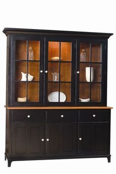 a black china cabinet with glass doors and drawers