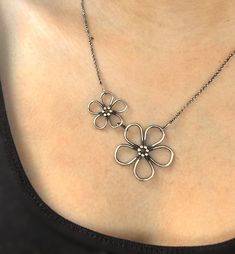 This is a handmade Sterling silver flower necklace, inspired by one of my bestselling flower rings. It features a large flower and a smaller one, attached to a sturdy yet delicate, adjustable Sterling silver chain. This necklace is handmade to order and is not duplicated from a mold. Each piece is handcrafted individually, and blackened for extra dimension. The smaller and larger flower make this necklace a great mother/ daughter gift. 🥰 You'll love this piece if you like: - handmade jewelry - Unique 3d Flower Jewelry, Unique 3d Flower Shaped Jewelry, Delicate Adjustable Flower Pendant Necklace, Adjustable Handmade Flower Shaped Jewelry, Minimalist Sterling Silver Flower Necklace, Silver Flower Jewelry With Handmade Flowers, Silver Flower Jewelry With Adjustable Chain, Delicate Adjustable Flower Necklace, Sterling Silver Jewelry With 3d Flower Design