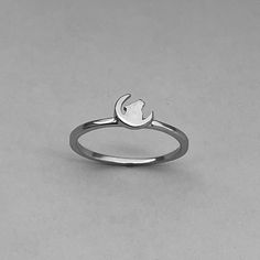 925 sterling silver Height: 3.5mm Finish: rhodium plated Can be worn: on multiple fingers and midi ring Symbolizes: loyalty, family, friendship, protection, and wisdom Dainty Moon-shaped Midi Promise Rings, Silver Moon Phase Crystal Ring, Dainty Stainless Steel Promise Ring, Silver Stainless Steel Stackable Rings, Adjustable Rings With Moon Charm, Elegant Sterling Silver Rings With Moon Charm, Minimalist Silver Open Moonstone Ring, Crescent Moonstone Ring In Sterling Silver, Silver Stainless Steel Open Midi Rings