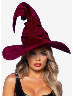 a woman wearing a red witches hat