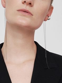 Editor's NoteThe elegant and classic jewelry from MOI studio is designed to match your mood- MOI 2st Earcuff X Chain Earring_27SET- Earcuff and chain earring in one set- Shiny and glossy metal texture- Layered look or single look- Daily point itemMeasurements (in.)- Size Chain 12.2in./earcuff 0.6in.*0.4in.Composition & Care- SILVER925- Beware of the wearing and storage of jewelry.- The size, shape, and color of the gemstone vary from product to product, and this is not de Classic White Gold Single Ear Cuff, Elegant Sterling Silver Clip-on Ear Cuff, Modern Pierced Ear Cuff For Formal Occasions, Silver Pierced Ear Cuff For Formal Occasions, Luxury Sterling Silver Single Ear Cuff, Minimalist White Gold Earrings For Evening, Modern Single Ear Cuff For Evening, Elegant Dangle Clip-on Ear Cuff, Elegant Silver Hoop Earrings With Adjustable Chain