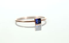 "14K GOLD BLUE SAPPHIRE SQUARE RING ◈ ITEM DETAILS * Gold - 14K Solid Gold (*Please contact us for the 18K gold) * Blue Sapphire - Natural / Non-treated / Grade \"AAA\"(High Quality) / Carat Weight : 0.17ct / 4mm X 4mm * Band - Width : 1.0mm / \"14K\" Stamped on the inside of the band / Glossy (Textured is also available) * Handmade * Made to Order * Ready to ship in 2 weeks ◈ BLUE SAPPHIRE SQUARE RING This square design ring is so special. The natural blue sapphire brilliantly shines. The heave Rectangular Blue Sapphire Ring In 14k Gold, Blue Square Cut Ring For Gift, Sapphire Ring Gold, Unique Gold Rings, Gemstone Jewellery Design, Ring Square, Gold Sapphire Ring, Gold Rings Simple, Blue Sapphire Ring