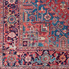 an old persian rug with many different colors and patterns on it, including red, blue,