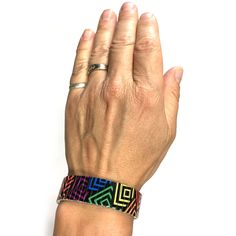 "Stretch bracelet with a rainbow square design. The art is \"baked\" into each bracelet making it very durable. Wrist-Art is made using a comfortable repurposed stainless steel watch band it will never rust and is generally considered hypoallergenic for most people. If you don't see your size in the preset list simply add the size of your wrist in the \"Notes\" section when you place your order. PLEASE NOTE: -The bracelet is more comfortable when it is a bit loose. -It will also stretch easily o Adjustable Multicolor Jubilee Cuff Bracelet, Modern Adjustable Multicolor Cuff Bracelet, Adjustable Multicolor Wearable Art Bracelet, Adjustable Multicolor Beaded Bracelets Wearable Art, Adjustable Multicolor Beaded Bracelets In Wearable Art Style, Wearable Art Adjustable Multicolor Beaded Bracelets, Artistic Multicolor Adjustable Beaded Bracelets, Adjustable Multicolor Rectangular Jewelry, Rectangular Multicolor Bracelet