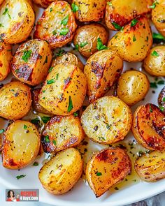 roasted potatoes with herbs on a white plate