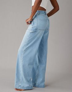 Spring Utility Wide Leg Flare Jeans, Oversized Mid-rise Pants With Pockets, Summer High Rise Baggy Wide Leg Pants, Fall Wide Leg Medium Wash Cargo Jeans, Trendy Baggy Wide-leg Flare Jeans, Trendy Baggy Wide Leg Flare Jeans, Oversized Mid-rise Bottoms For Fall, Chic Oversized Straight Leg Bottoms, Baggy Mid-rise Wide Leg Pants For Fall