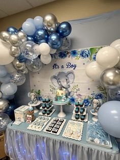 an elephant themed birthday party with balloons and desserts