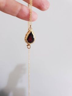 Gold pendant necklace, gold garnet necklace, January birthstone necklace mom, red garnet necklace, teardrop gemstone necklace, Mom's gift This Garnet teardrop pendant necklace was designed in an antique style, with a red garnet birthstone pendant in a teardrop shape. The Garnet necklace is handmade and delicate and available both in 14 karat gold filled and sterling silver Dimensions: Pendant height is 0.5 inches and it is 0.3 inches wide. This pendant necklace is available in multiple lengths. Red Birthstone Teardrop Pendant Jewelry, Red Teardrop Pendant Birthstone Jewelry, Ruby Teardrop Pendant Necklace, Red Teardrop Gemstone Drop Necklace, Red Teardrop Gemstone Necklace, Red Gemstone Drop Necklace For Gift, Ruby Teardrop Pendant Jewelry For Gift, Garnet Drop Jewelry For Gift, Yellow Gold Birthstone Drop Necklace Gift