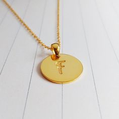 All of our products are handmade.A beautiful handmade 0.75" inch gold monogram necklace, you can choose any 1-3 initials.Necklace is Engraved - Not Stamped.The custom name disc necklace is made out of 925 sterling silver,it measures about 0.75",1.2mm thickness.The length of sterling silver chain can be selected in 14",16",18",20" or 22".You can have it done in sterling silver,18k gold plated,white gold plated.Please leave the text you would like to be engraved in the -notes to seller- section.In Gold Name Necklace With Round Pendant, Adjustable Gold Initial Necklace For Personalized Gift, Gold Minimalist Initial Necklace Customizable, Minimalist Gold Initial Necklace Customizable, Minimalist Customizable Gold Initial Necklace, Gold Personalized Initial Necklace Adjustable, Gold Initial Pendant Necklace For Personalized Gift, Gold Round Pendant Name Necklace As Personalized Gift, Gold Round Pendant Name Necklace For Personalized Gift