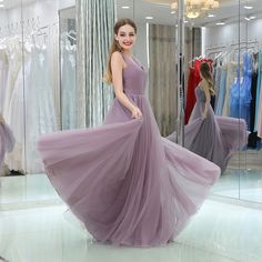 Sleeveless Tulle Long Wedding Party Bridesmaid Dress - Uniqistic.com Floor-length Tulle Bridesmaid Dress For Evening, Elegant Floor-length Tulle Bridesmaid Dress, Wedding Party Bridesmaid Dress, Lavender Bridesmaid Dresses Tulle & Chantilly, Bridesmaid Dresses Purple Tulle & Chantilly, Elegant Purple Floor-length Bridesmaid Dress, High Neck Bridesmaid Dresses, Tulle Long Prom Dress, Designer Formal Dresses