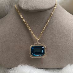 JP0059-LBT 'Gossip' London Blue Topaz Emerald Cut Pendant in 18K Yellow Gold with Diamonds 30'' Chain included. Stone Size: 24 x 18 mm Approx. gemstone Wt: 42.13 Carats (London Blue Topaz) Diamonds: G-H / VS, Approx Wt: 0.53 Cts Luxury Blue Topaz Jewelry, Luxury Aquamarine Pendant Necklace, Luxury Topaz Necklace With Diamond Accents, Luxury Topaz Necklace With Gemstone Accents, Luxury Large Stone Jewelry, Luxury Aquamarine Jewelry With Diamond Accents, Luxury Topaz Pendant Necklace, Luxury Aquamarine Necklace For Formal Occasions, Luxury Blue Jeweled Jewelry