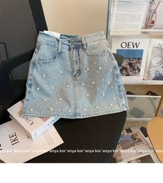 Dare to be bold and stylish with our rivet embellished layered denim skort from the 2023 Summer Collection! Lovingly crafted for the modern fashionista. this skort promises to make a lasting impression with its intricate patchwork. mid-waist fit. and zipper & button closure. Why You'll Fall In Love Rivet Embellished: Make a statement with this skort. adorned with intricate rivet details for a touch of chic sophistication. Layered Denim: Its layered denim material ensures comfort and breathability. allowing you to move freely and flaunt your style with ease. Patchwork Perfection: Each layer of denim is expertly adorned with an intricate patchwork design. adding a delightful touch of visual allure. Mid-waist Fit: Its mid-waist fit accentuates your figure. creating the perfect balance between Trendy Spring Mini Skirt, Trendy Summer Pencil Skirt, Trendy Summer Mini Skirt, Trendy High-waist Denim Skirt, Trendy High Waist Denim Skirt, Trendy Summer Denim Skirt, Trendy Pleated Skirt For Spring, High Waist Jean Shorts For Spring Party, Trendy Mid-rise Denim Skirt For Spring