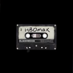 an old black and white cassette with the word hbomax written on it