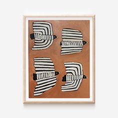 four black and white abstract paintings in a wooden frame on an orange background, each with different shapes