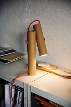 a lamp that is sitting on top of a table next to a bookshelf