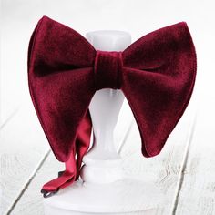 Introducing our exquisite collection of handmade velvet bowties, the epitome of timeless elegance and sophistication. Crafted with meticulous attention to detail, these bowties are designed to make a statement and elevate any gentleman's ensemble to new heights. Each bowtie is meticulously handcrafted using the finest quality velvet fabric, renowned for its luxurious texture and lustrous sheen. The softness of the velvet not only adds a touch of opulence but also ensures optimal comfort and a pe Adjustable Red Suit And Tie Accessories For Wedding, Red Dapper Tie For Wedding, Red Dapper Ties For Wedding, Adjustable Red Bow Tie For Wedding, Dapper Red Bow Tie For Party, Classic Red Bow Tie For Wedding, Red Tie With Decorative Bow For Formal Occasions, Red Formal Ties With Decorative Bow, Red Suit And Tie Accessories For Party