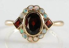 SHIVAY JEWELS 14k Rose Gold Plated  3.50Ct Oval Natural Red Garnet & Fire Opal Art Deco Ring We offer Customization If you want to add personal touch to this piece contact us and we will create one just for you. You can customize the following things given below : 1. Ring Resizing 2. Redesign 3. Metal Change ( 925 Sterling Silver / 10k Gold / 14k Gold / 18k Gold ) 4. Metal Color Change ( White / Rose / Yellow ) 5. Color Stones ( Red / Green / Yellow / Blue / Black ) 6. Engraving ( No. of characters will subject to size and space in the jewelry Payment  Policy 1. We accept payment via PayPal only. 2. You can also use a credit card for payment by using PayPal as a guest. 3. Payment is required within 3 days after buying. Shipping Policy 1. We ship worldwide. 2. Handling time is 5 business da Garnet Ring Vintage, Opal Art, Gemstone Rings Vintage, Antique Wedding Rings, Opal Ring Gold, Turkish Jewelry, Gold Art Deco, Garnet Jewelry, Deco Ring