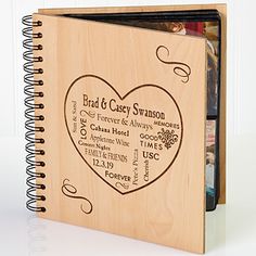 a personalized wedding guest book with the names and date written on it in wood