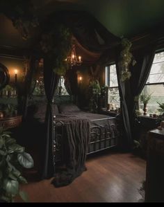 a bedroom with a canopy bed and lots of greenery on the wall above it