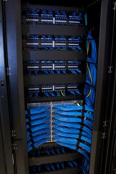 the inside of a server with many blue wires