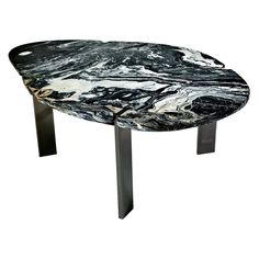 a black and white marble coffee table with metal legs on an isolated white background for display