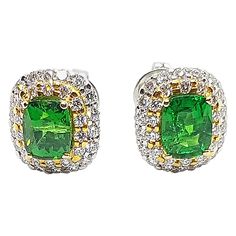 Tsavorite 2.91 carats with Diamond 1.01 carats Earrings set in 18 Karat White Gold Settings Width: 0.6 cm Length: 0.7 cm Total Weight: 5.89 grams "We first opened doors in 1980 when it was then situated in the vicinity of the Victory Monument; a small and modest storefront with a couple of counters. From its humble beginnings to where it stands today, our company has proven its abilities as a jeweler. Since the beginning, we have been supplying fine quality pieces to dealers, wholesalers and cus Contemporary Earrings, Earrings Set, Jewelry Earrings Studs, Floral Rings, Earring Set, Garnet, Monument, Diamond Earrings, Mens Jewelry