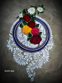 an artistically designed plate with flowers on it