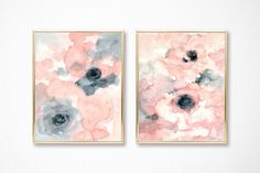 two paintings on the wall with pink and grey flowers