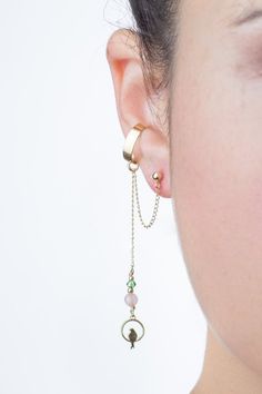 This minimal and dainty Gold filled ear cuff earring has a unique 14k gold filled sitting bird charm pendant combined with a Rose Quartz gemstone bead, a tiny green Swarovski crystal bead, and gold filled beads.For this unique EAR CUFF earring, you need only ONE piercing! The cuff is placed on the middle ear cartilage so it will look like you have a piercing there as well!▹▸📩📩📩 In a hurry to get your package? Add this listing to your cart before checkout to upgrade from regular shipping (whic Minimalist 14k Gold-filled Dangle Jewelry, Minimalist 14k Gold Filled Dangle Jewelry, Brass Dangle Jewelry With Delicate Chain, Delicate Brass Dangle Jewelry With Chain, Dainty Gold-plated Ear Cuff, Dainty Gold-plated Single Ear Cuff, Dainty Gold Plated Single Ear Cuff, Minimalist Brass Dangle Jewelry, Elegant 14k Gold Filled Dangle Cartilage Earrings