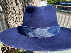 Designer choice!! Take a look at this fun denim blue adjustable hatband with different colors of denim that really make this hatband pop on any style/color of hat. The band is 22.5" x 1.25" and has adjustable navy-blue suede ties in the back so it can fit hats from 22.5-34". The band is secured by two gold tie clamps in the back to give it a nice, finished look. The hat band has been sewn together and treated with fray protector to help keep this hatband looking good for years to come. To comple Navy Flat Brim Hat, Adjustable Navy Hat With Flat Bill, Adjustable Navy Flat Bill Hats, Blue Denim Flat Brim Hat, Navy Casual Hat For Fall, Navy Casual Fall Hats, Adjustable Denim Blue Wide Brim Hat, Denim Blue Brimmed Hat, One Size Fits Most, Adjustable Wide Brim Denim Blue Hat