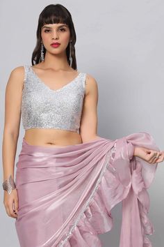 Shimmer & Shine in this simple silver sequins blouse which can pair well with almost any saree! Product Features: Color: Silver Fabric: Sequin Closure: Back Sizing: Not stretchable - margin of 2 inches inside seams for adjustments Occasion: Party, Wedding, Bridesmaid, Festive Product Type: Blouse Disclaimer: There will be slight difference in digital to actual image Lavender Saree, Sequin Belt, One Minute Saree, Sequins Saree, Sequins Blouse, Formal Saree, Saree With Belt, Draped Saree, Silver Blouse