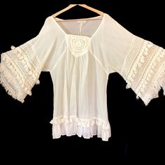 Gorgeous New 100% Cotton Boho Tunic From European Designer Lara Ethnics - Tons Of Tassels And Lacy Embroidery. L/Xl Bust 21.5” Across. Length 32” Bohemian Cotton Peasant Top With Lace Trim, White Peasant Top With Boho Collar For Summer, Bohemian Embroidered Peasant Top For Vacation, Bohemian Embroidered Blouse For Vacation, Bohemian Blouse With Fringe For Vacation, Bohemian Fringe Blouse For Vacation, Flowy Bohemian Peasant Top For Festivals, White Bohemian Peasant Top With Boho Collar, Summer Peasant Blouse With Tassels