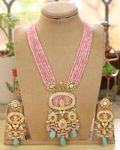 Sabyasachi inspired Kundan Polki necklace of Beads with matching earrings Perfect for any kind of occasions and ceremonies. You can wear it with Saree lehenga and Evening Gowns. Highest quality and craftsmanship. Arrives in box Please let me know if you have any questions Luxury Pink Kundan Necklace For Parties, Luxury Pink Kundan Necklaces, Temple Jewelry Sets With Dangling Beads For Wedding, Traditional Polished Beads Earrings For Wedding, Traditional Beaded Earrings For Reception, Wedding Jewelry Sets With Dangling Beads For Festivals, Diwali Wedding Bridal Necklace With Polished Beads, Chandbali Kundan Necklace With Dangling Beads For Wedding, Temple Jewelry Beaded Necklace For Wedding With Dangling Beads