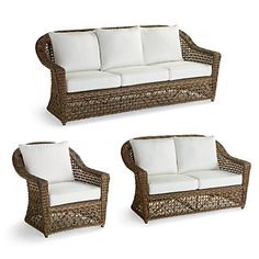 three wicker couches and two chairs with white cushions