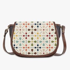 Carry a piece of Scandinavian chic with our Danish Modern Floral Saddle Bag. This mid-century inspired crossbody handbag adds a touch of vintage charm to any outfit. Compact yet spacious, it's perfect for on-the-go style. Bring out your inner flower child today! Key Features ✅ Made of premium PU leather fabric. ✅ Durable adjustable shoulder strap for various occasions. ✅ Classic Flap type & Smooth top zipper closure. ✅ Ultra-large interior capacity, big compartment with 3 pockets for the storage of daily must-haves. Retro Crossbody Shoulder Bag With Adjustable Strap, Retro Saddle Bag For Daily Use, Retro Satchel Saddle Bag For Everyday Use, Retro Brown Saddle Bag For Daily Use, Retro Satchel Shoulder Bag With Detachable Strap, Retro Brown Saddle Shoulder Bag, Retro Beige Satchel With Detachable Strap, Beige Retro Satchel With Detachable Strap, Retro Saddle Bag With Detachable Strap