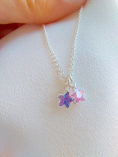 "925 Sterling Silver star charm necklace. One charm is an amethyst and the other one is rose quartz. If you prefer a different stone combination, please contact us! Please choose your favorite necklace length at checkout. All lengths have a one inch extender, that way you'll have some wiggle room to play with the length. For example, if you choose a 14 inches necklace length, you'll have options to close the necklace at any length between 14 inches and 15 inches. Some of this charms are sold by Cute Silver Pendant Charm Necklace, Cute Sterling Silver Pendant Charm Necklaces, Cute Sterling Silver Pendant Charm Necklace, Silver Star-shaped Dainty Jewelry, Sterling Silver Star Necklace In Silver, Sterling Silver Jewelry Pendant With Star Charm, Silver Crystal Pendant Necklace With Charms, Handmade Silver Charm Necklace For Her, Handmade Silver Charm Necklace As Gift For Her