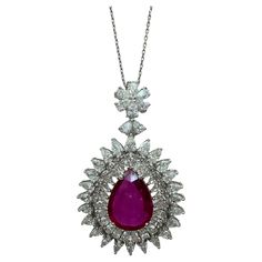 Elevate any outfit with our stunning 18k African Ruby and Diamond Pendant Necklace. Crafted in 18k white gold, this necklace features a 17.5 inch chain and a dazzling 1.75 inch pendant adorned with princess cut diamonds (4.55 carats) and a vibrant African ruby (6.95 carats). Add a touch of elegance and luxury to your wardrobe with this one-of-a-kind piece. In good condition with minor surface wear. 18k African Ruby and Diamond Pendant Necklace  Condition: In good condition with some minor surface wear consistent with age. Length: 17.5 inch chain, 1.75 inch pendant. Metal: 18k White Gold Weight: 12.66 grams Princess Cut Diamonds: 4.55 carats  African Ruby: 6.95 carats African Princess, Princess Cut Diamond, Diamond Pendant Necklace, Princess Cut Diamonds, Princess Cut, Diamond Pendant, Metallica, Necklace Etsy, Jewelry Necklace Pendant