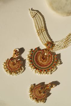 Imaari Statement Necklace Set - Multicolor navratan stones with gold plating Festive Multicolor 22k Gold Bridal Necklace, Gold Plated Chandbali Temple Jewelry Sets, Gold Plated Meenakari Jewelry For Puja, Multicolor Temple Jewelry Chandbalis With Tilla, Multicolor Chandbalis With Tilla In Temple Jewelry Style, Multicolor 22k Gold Necklaces For Celebration, Gold Plated Meenakari Temple Necklace Chandbali, Gold Plated Chandbali Jewelry Sets For Celebration, Gold Plated Meenakari Temple Necklace In Chandbali Style