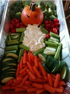 carrots, celery, cucumbers and other vegetables in a tray