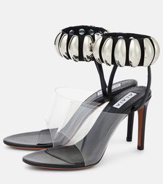 a pair of high heeled shoes with clear heels