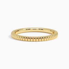 Jade Trau Esthética Wedding Ring - 18K Yellow Gold. Soft fluted forms oscillate across the surface of this modern band adding a hint of architectural flair to a timeless, romantic design. Pair with satin finish or diamond-accented bands to create a personalized and chic stack. 
 
 Jade Trau adds a signature spin on classic diamond staples, crafting designs timeless enough to evolve with you and unique enough to make a statement. Modern Twist Yellow Gold Stackable Rings For Formal Occasions, Modern Formal Rings With Fluted Bezel, Modern Diamond Cut Bands For Formal Occasions, Modern Formal Bands With Diamond Cut, Modern Formal Diamond Cut Bands, Modern Halo Yellow Gold Rings, Modern Yellow Gold Bands For Promise Ring, Modern Yellow Gold Rings With Decorative Band, Modern Yellow Gold Stackable Rings With Round Band