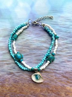 🌴Tropical paradise! 🌺 This handmade aqua and white matte seed bead ankle bracelet, with turquoise turtle bead charms and turquoise stones will give you that feel of the tropics! Makes a lovely gift for your special someone or keep as a "Me Day" beach accessory! Sea turtles symbolizes longevity, peace, grounding, ancient wisdom, and emotional strength.  The anklet measures 10 inches long with the silver plated 2-inch extender.  I will gladly adjust the size of the anklet for a customized fit. Please follow the steps on the chart in the photos to measure your ankle or measure your favorite anklet, then send me a message with your desired size. Please measure your ankle before ordering as I do not offer returns or exchanges for resizing MEASURING: These anklets are made on strong string mak Florida Vibes, Bracelets Summer, Turquoise Anklet, Beaded Items, Tropical Jewelry, Beaded Ankle Bracelets, Beachy Jewelry, Summer Anklets, Beaded Ankle