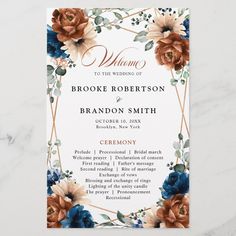 an elegant wedding program card with flowers on it