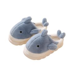 a pair of blue and white slippers with a whale on it