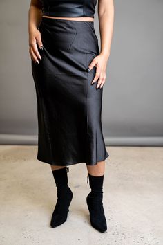 A slip skirt is a wardrobe must-have. This classic is the perfect wardrobe essential that can go from day to night depending on your vibe. Wear it with heels for the perfect date night look, or wear it with sneakers to transition it to the perfect errand skirt. FEATURES Zipper side closure Elastic waist Light stretch SIZE & FIT Model is wearing a size: Small. True to size. DETAILS 100% Polyester CARE Hand wash cold. Do not bleach. Line dry. Iron low. Fall Night Out Midi Pencil Skirt, Sleek Evening Skirt For Spring, Sleek Party Midi Skirt, Sleek Midi Skirt, Sleek Evening Midi Pencil Skirt, Midi Pencil Skirt For Date Night In Fall, Sleek Midi Pencil Skirt For Night Out, Fall Midi Pencil Skirt For Date Night, Chic Evening Pencil Skirt For Fall