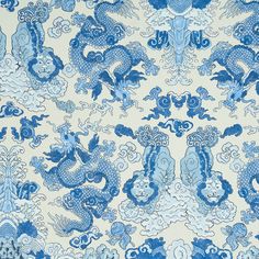 a blue and white wallpaper with dragon designs