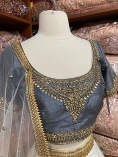 Jasmine white plain lehenga with gold border teamed with contrasting grey intricate in kundan, cut dana and stone work blouse and net dupatta. Fabric: Silk Occasion: Wedding Ceremony or Reception. WASH CARE INSTRUCTIONS - Please Dry clean only when it is applicable. Slight color variation is possible due to digital photography. This outfit can be customized in multiple colors and specific to client measurements. 120 days of production time is required and are for bulk orders only!Order are proce Semi-stitched Stone Work Dupatta, Semi-stitched Silver Choli With Zari Work, Festive Lehenga With Stone Work, Wedding And Navratri Stone Work Sets, Elegant Choli With Stone Work For Festivals, Festive Choli With Stone Work And Traditional Drape, Elegant Stone Work Choli For Festivals, Festive Elegant Lehenga With Stone Work, Festive Traditional Drape Choli With Stone Work