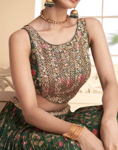 COLOR : Dark Green FABRIC : Top (Blouse) - Pure Georgette, Bottom (Lehenga) - Pure Georgette, Inner - Cancan, Dupatta - Chinon WORK : Thread Work, Beads, Stones, Sequins, Digital Print, Lace Border OCCASION : Wedding, Reception, Sangeet, Engagement READY-TO-WEAR : NoSTITCHING : Available as semi-stitched fabric, can be stitched using standard size option (+$30). Note: There might be a slight color variation due to lighting and flash used during photoshoot. The bright shade seen is the best close Sleeveless Traditional Wear With Intricate Embroidery For Weddings, Sleeveless Traditional Wear For Wedding With Intricate Embroidery, Semi-stitched Sleeveless Wedding Sets, Sleeveless Embroidered Wedding Lehenga, Sleeveless Georgette Choli For Wedding, Sleeveless Resham Embroidered Fabric For Wedding, Sleeveless Embroidered Fabric For Wedding, Sleeveless Embroidered Sets For Wedding, Sleeveless Embroidered Wedding Sets