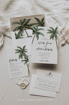 wedding stationery with palm trees and rings