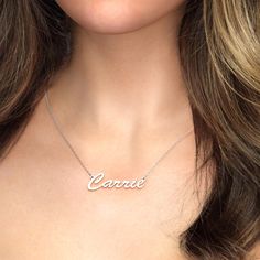 Sometimes, simple is best! This sterling silver classic name necklace is the perfect accessory to pair with almost everything, thanks to simple, delicate script that provides an elegant, feminine look. With room for up to nine characters, it’s ideal for celebrating anyone, and it’s also a wonderful design for keeping a favorite word that close to your heart.Chain Type: Width: 30 mmHeight: 15 mmThickness: 1.2 mmMaterial: Plating Color: Silver Elegant White Gold Name Necklace For Everyday, Elegant Everyday White Gold Name Necklace, Signature Silver Jewelry With Names, Elegant Sterling Silver Nameplate Initial Necklace, Classic Name Necklace With Hallmark For Anniversary, Elegant Custom Name Initial Nameplate Necklace, Minimalist White Gold Name Necklace For Anniversary, Delicate Silver Initial Pendant Name Necklace, Delicate Silver Initial Pendant Necklace